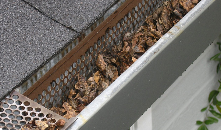 clogged gutters causing water overflow