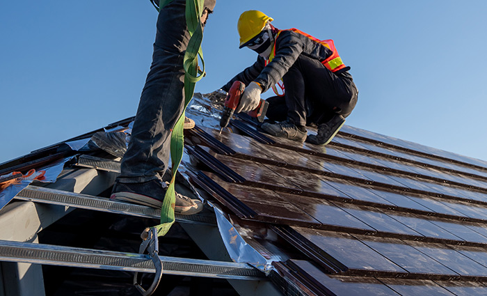 professional roofer installing shingles on a Florida home - the installation process